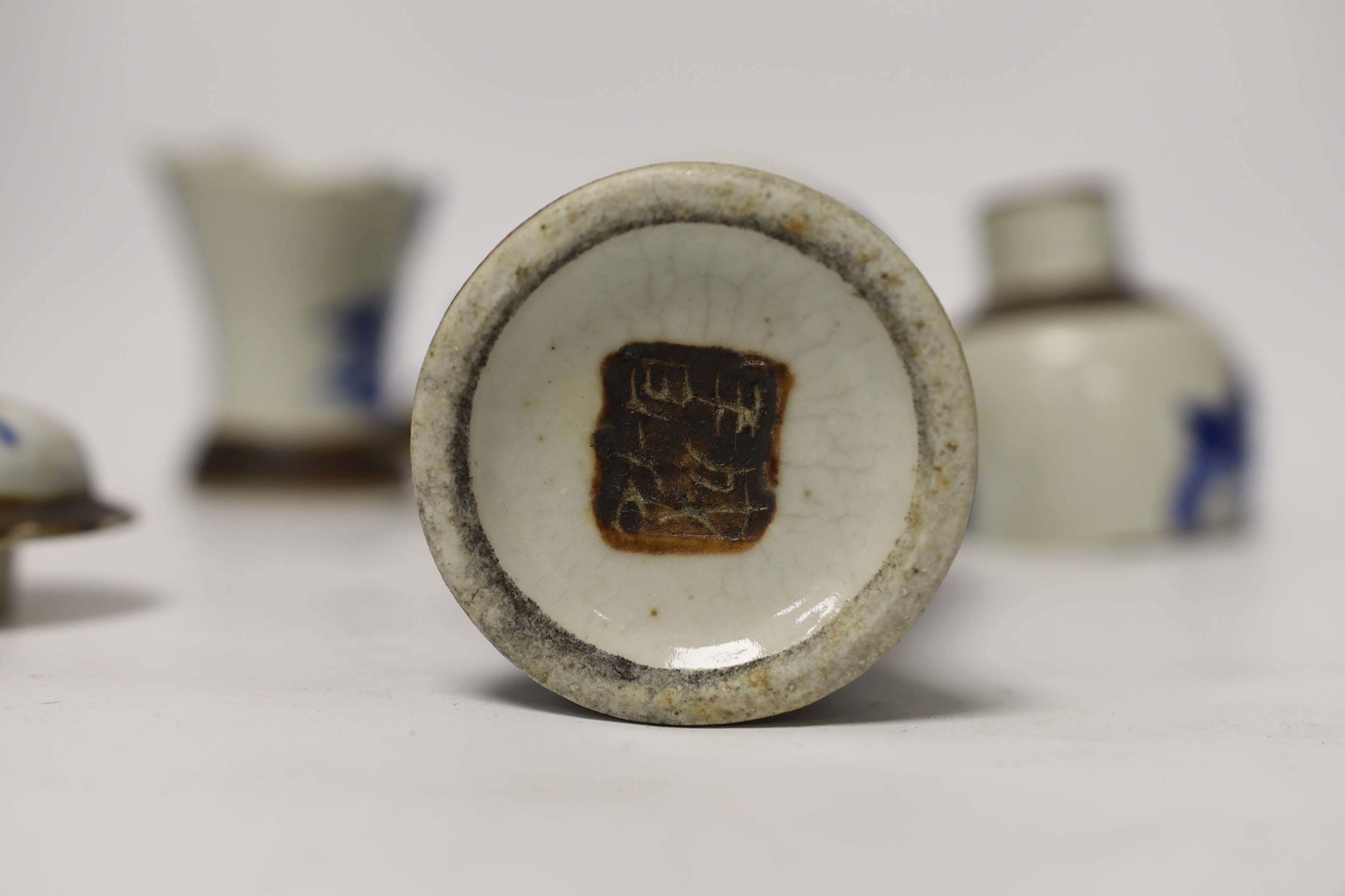 A pair of 19th century Chinese crackleware vases and covers, 15cm high (one badly broken)